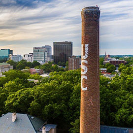 The USC smokestack rises above the skyline of Columbia